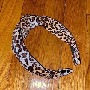 Velvet leopard print hard headband like new.